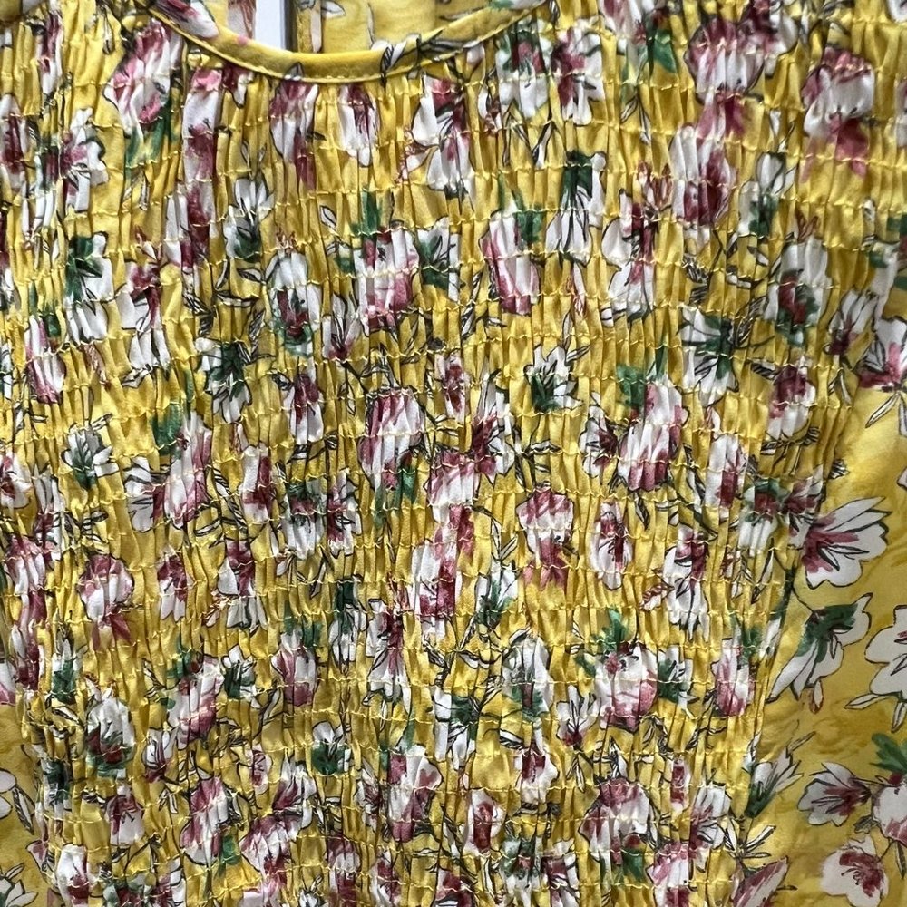 Very bright and lovely top with gathered front .